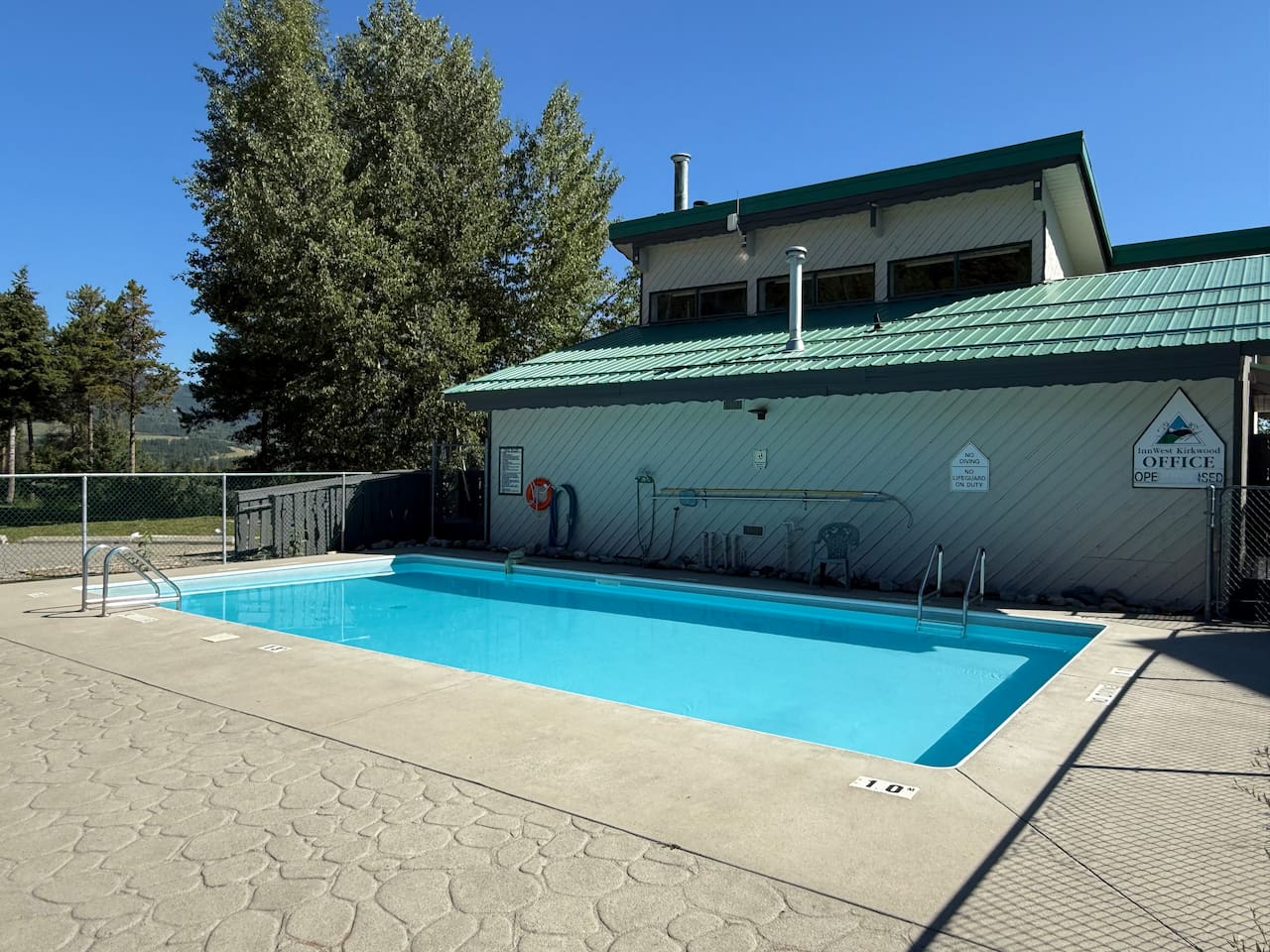Cool down in the shared outdoor pool (open seasonally) which overlooks the stunning mountain landscape surrounding the townhouse complex