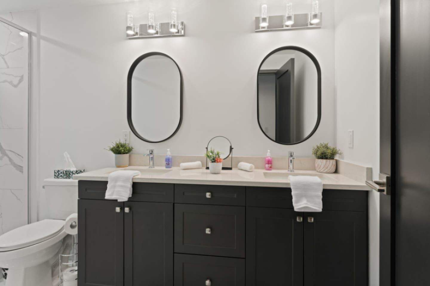 Full bathroom A neutral palette with natural stone accents