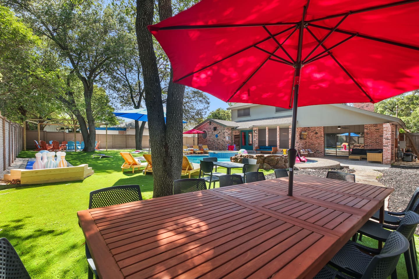  Covered patio dining surrounded by fresh air and colorful umbrellas.
