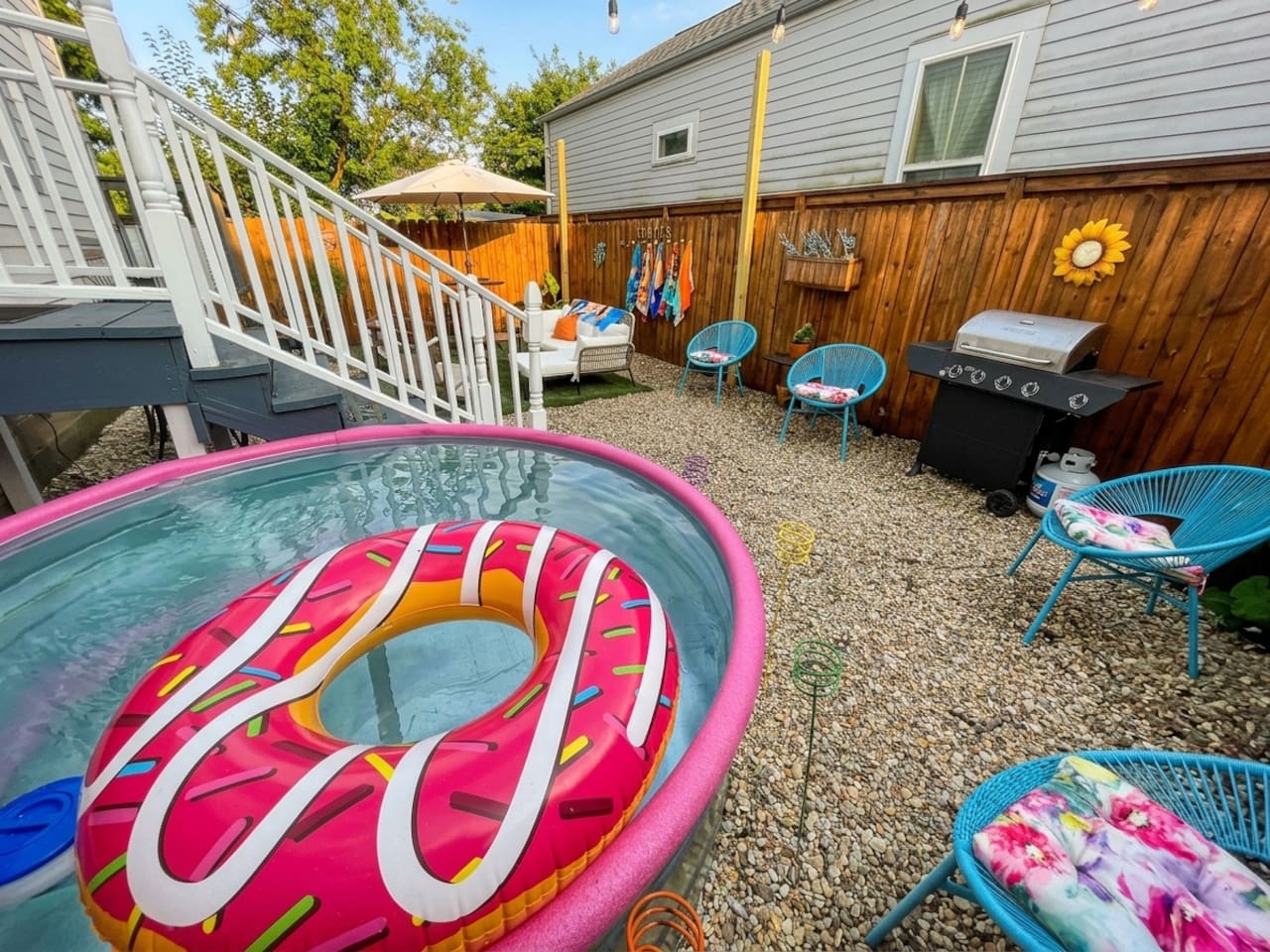 The backyard patio is perfect for enjoying a private hang with your group under the string lights!  Comfy outdoor sectional, high-top dining table, and stylish chairs.  Also feel free to use the propane BBQ grill.  Oh, and the Cowboy POOL!