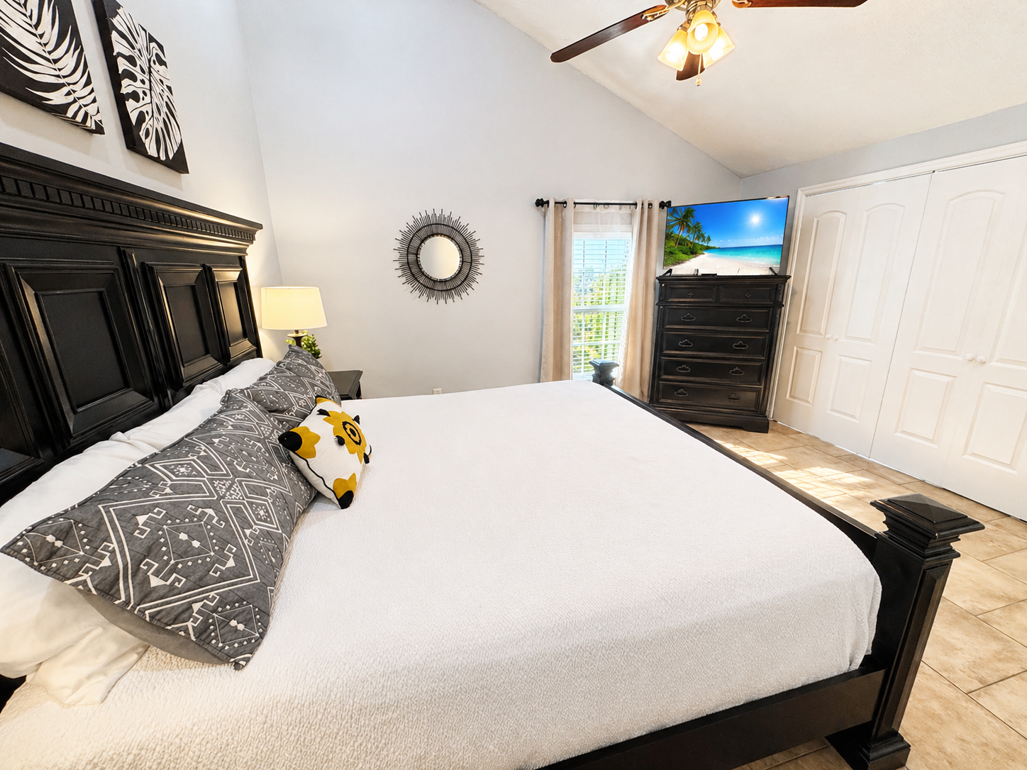 Master bedroom with king bed and vaulted ceilings