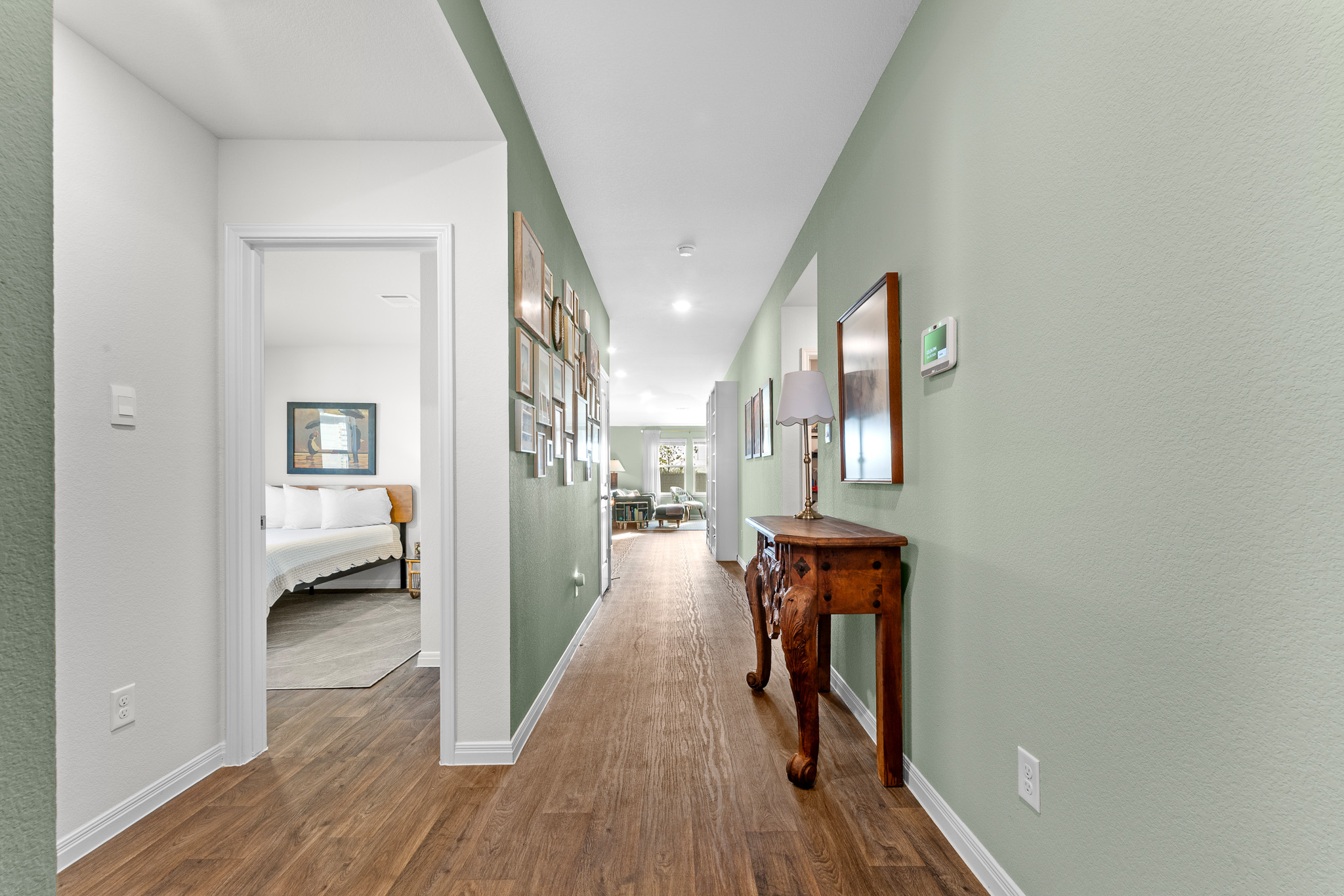 The gorgeous hall leads you past bedroom 2, 3, laundry room & the family bathroom into the kitchen, dining and living room. 