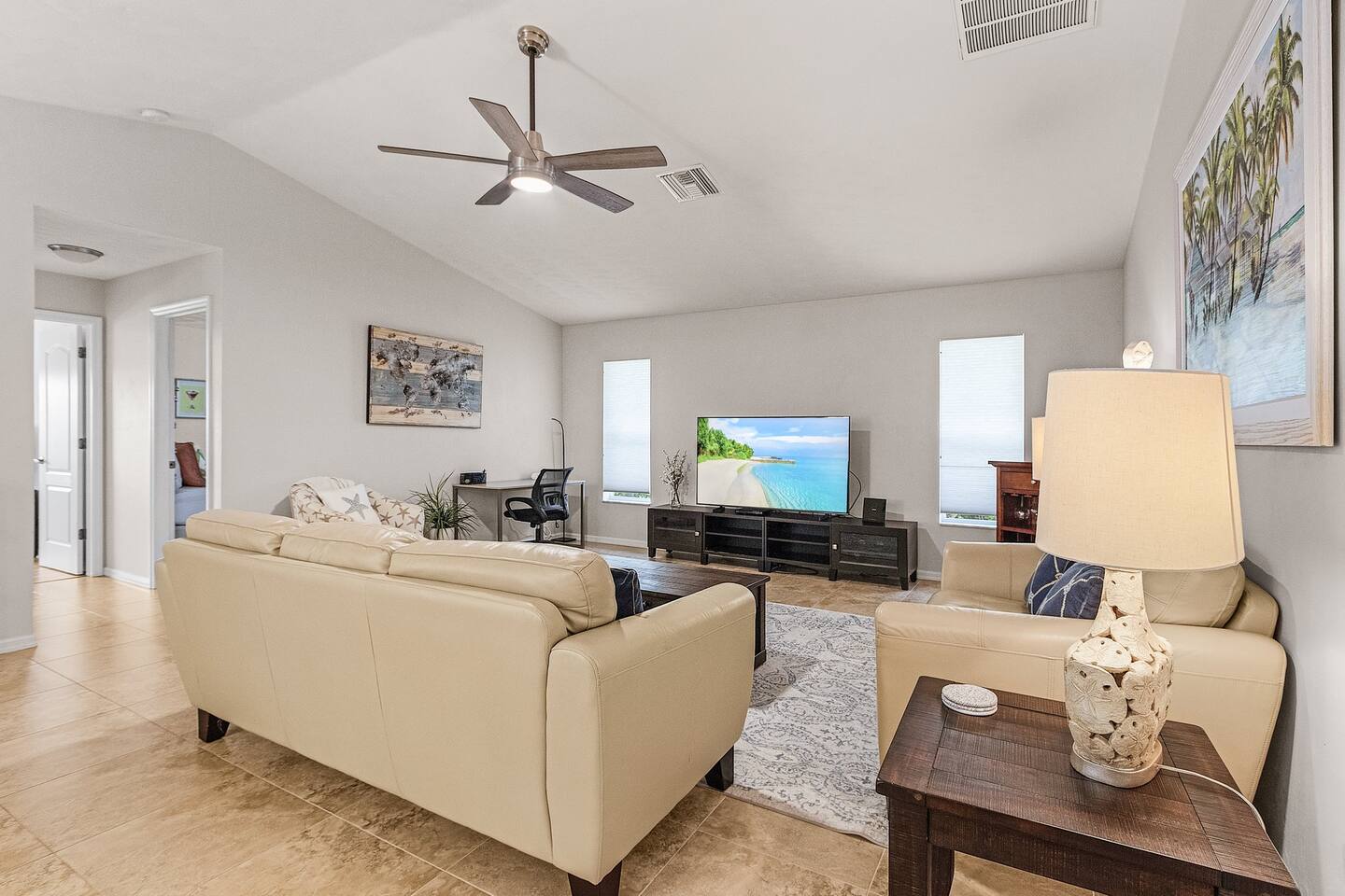 Spacious living room featuring a large TV, perfect for cozy movie nights!