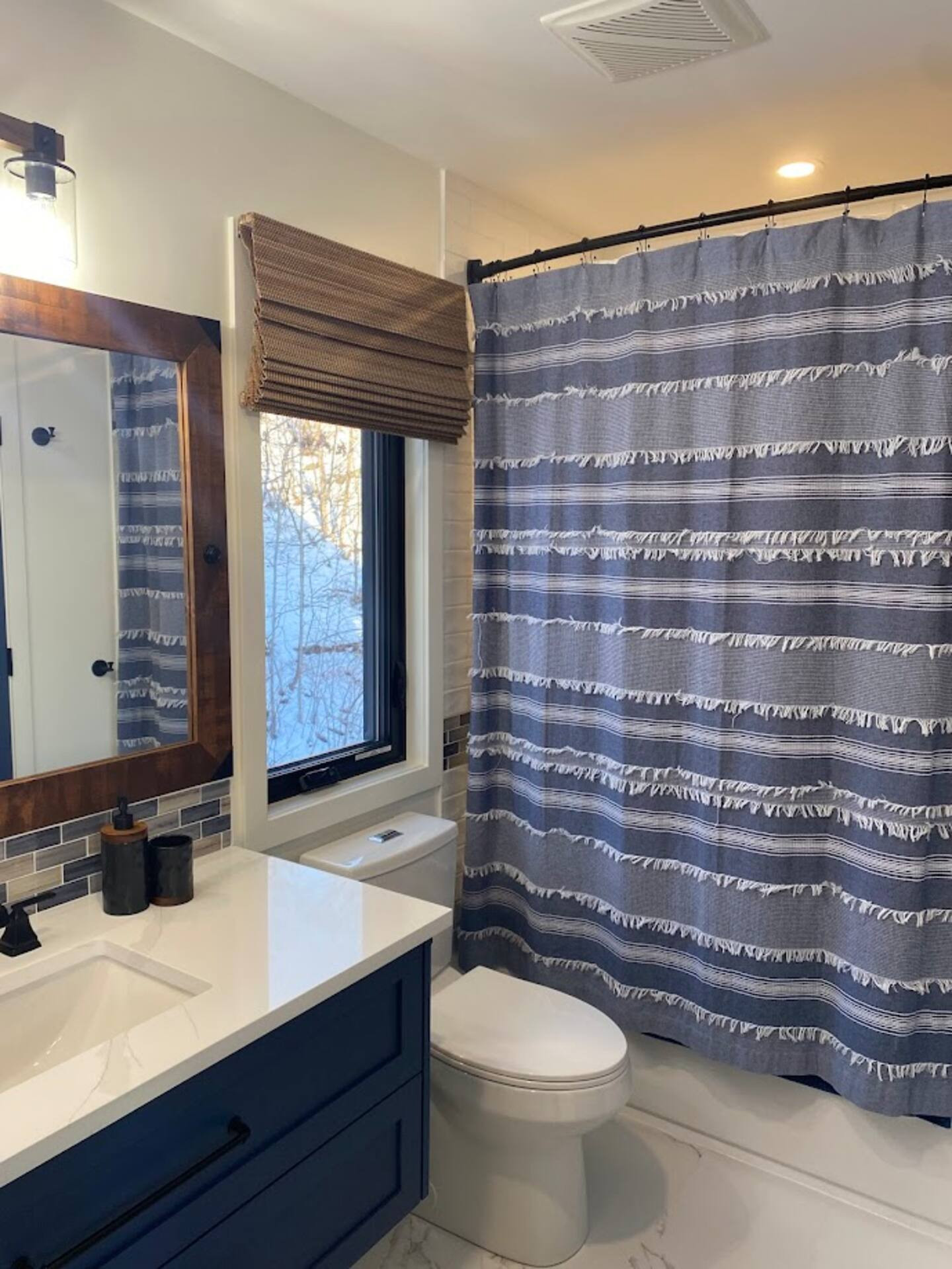 Main floor bathroom with tub and shower