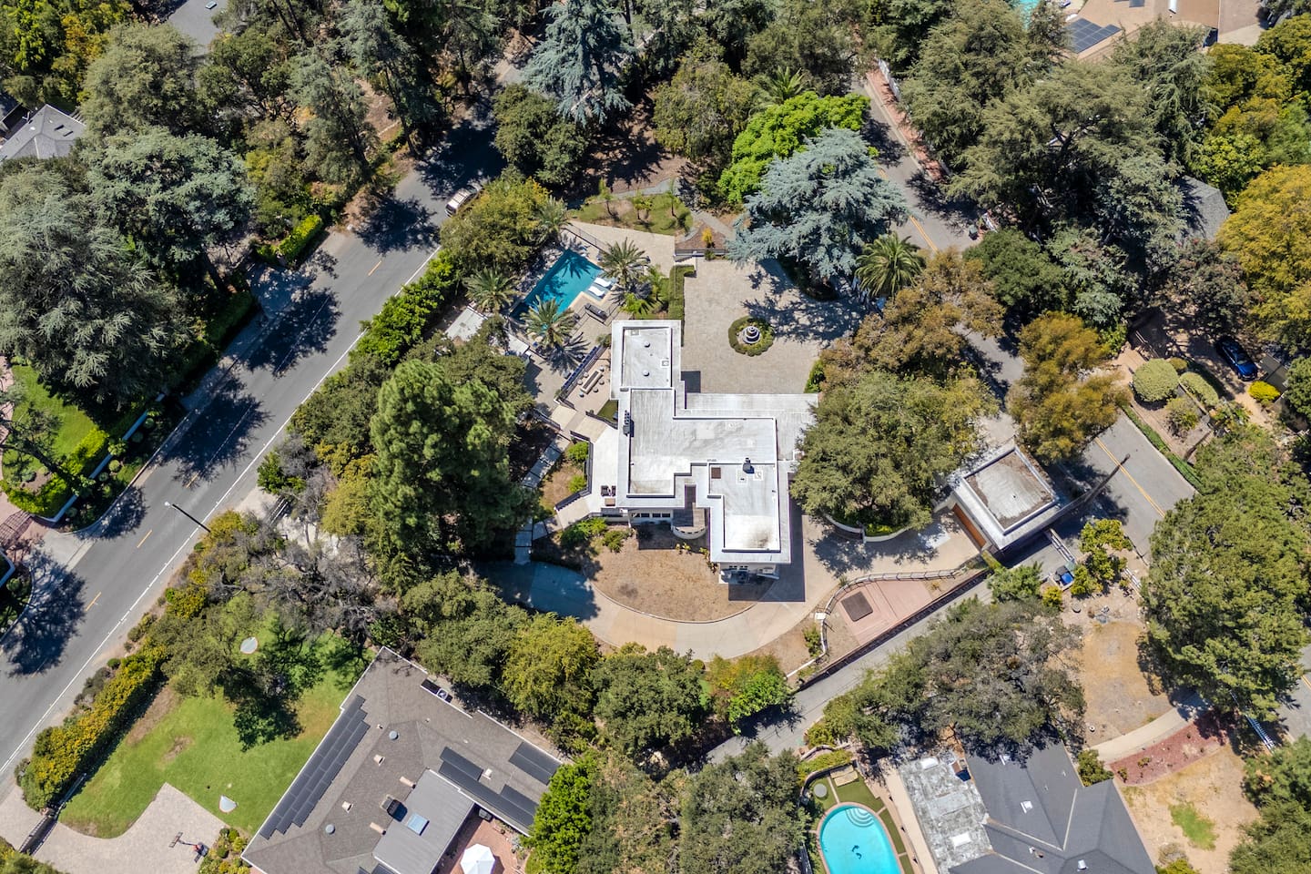 Aerial View Featuring the Home & Pool

