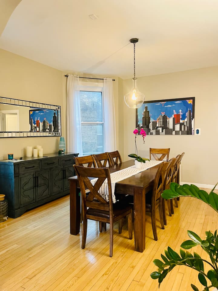 Dining room with warm lighting and plenty of space for group meals.