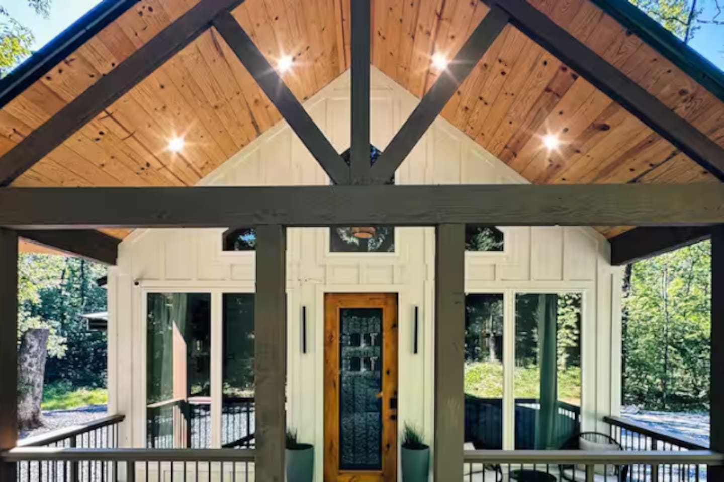 Soaring vaulted ceilings with rustic timber accents