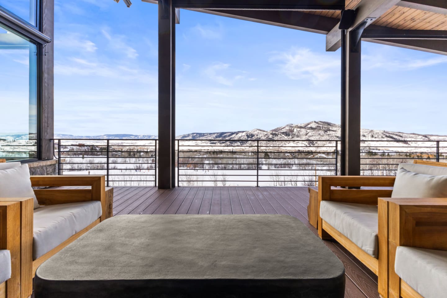 Main Level Wraparound Covered Deck with a view