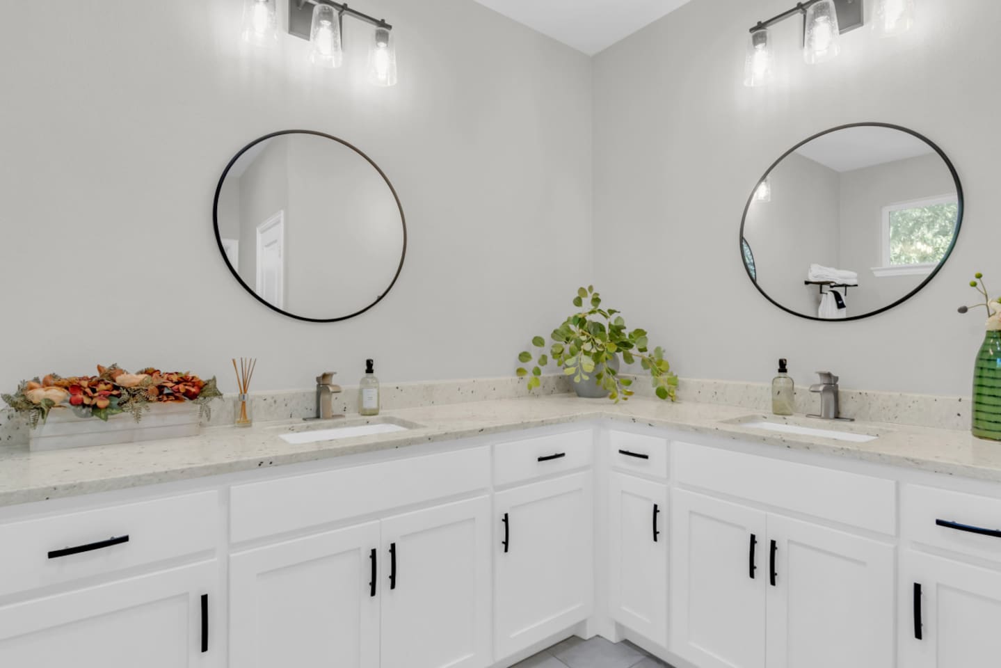 Spa-inspired bathroom with walk-in shower, dual vanity, and premium essential bath products.
