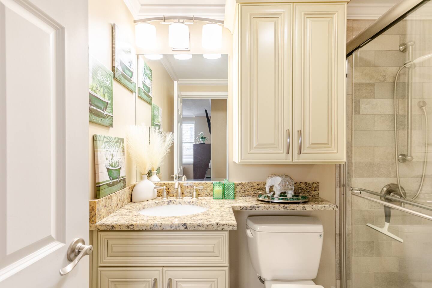 Guest bath vanity w/ dual sinks & granite countertop space.