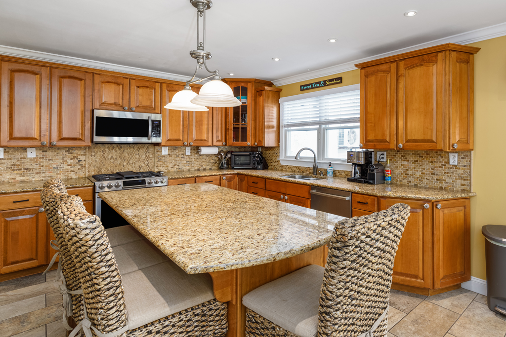 Fully stocked kitchen with an air fryer, toaster, over/stove, coffee machine and yes, even a kitchen aid mixer!
