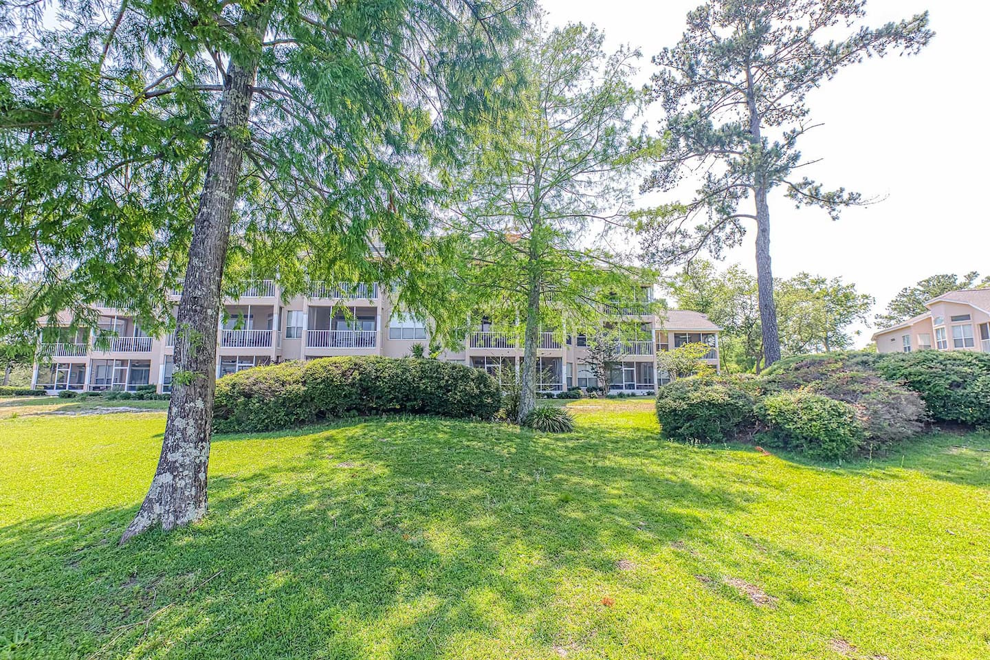 Exterior Oasis: Embrace relaxation in lush surroundings just steps from Gulf Shores' beauty!