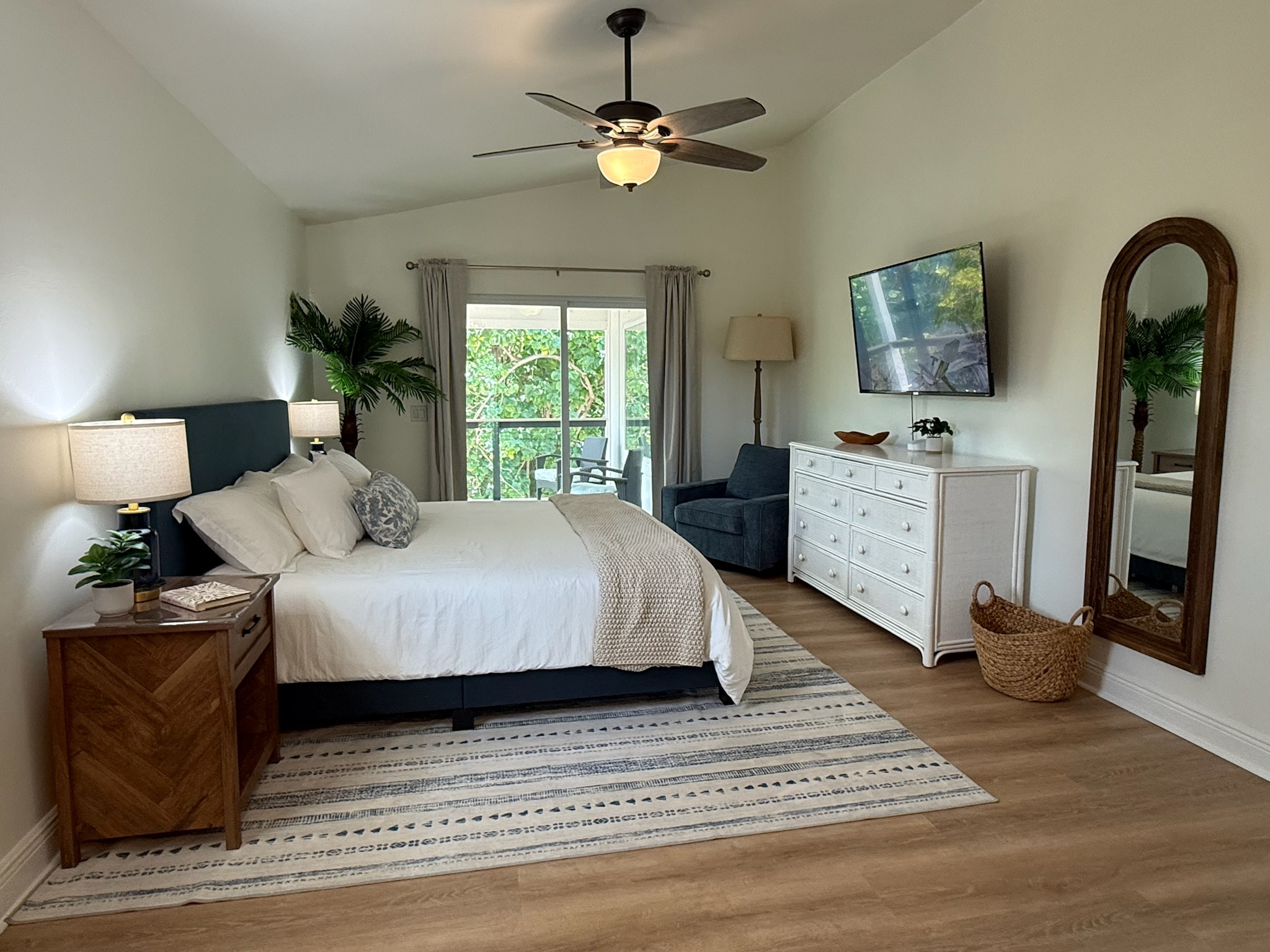 Experience secluded luxury in this spacious King suite, featuring an open layout and a private backdrop of lush foliage