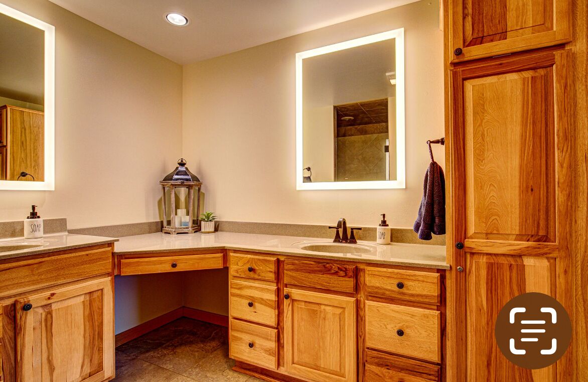 Primary/master bedroom en suite with shower and double vanities