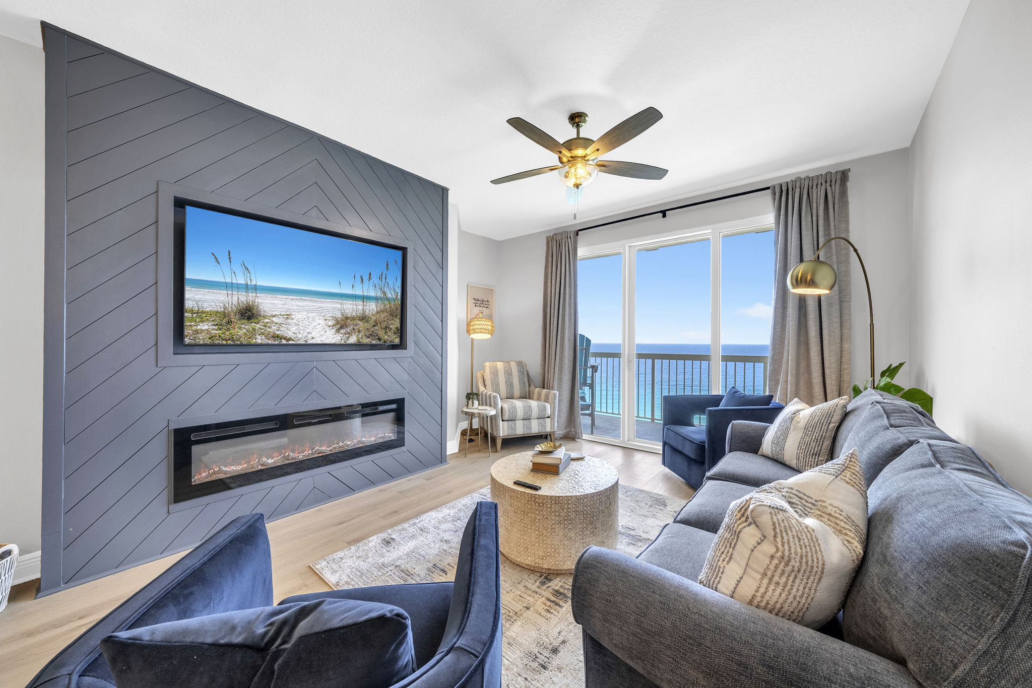 Nights are cozy around this electric fireplace & 65" smart TV paired with that breathtaking view!