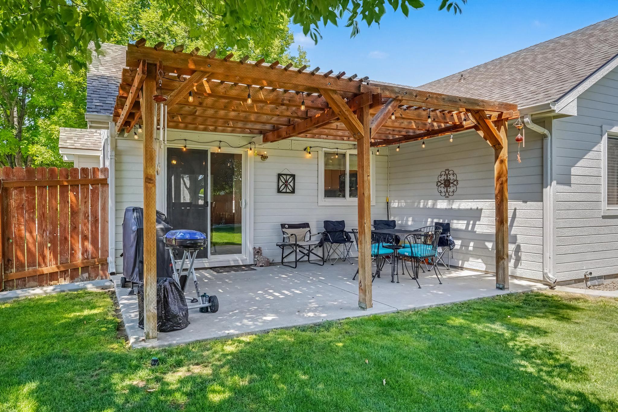 Part of the backyard oasis, this spacious patio is the perfect place to relax and enjoy the outdoors. With comfortable seating for up to 8 guests and a dining table for meals, morning coffee, or evening conversations, it’s an inviting space to gather.