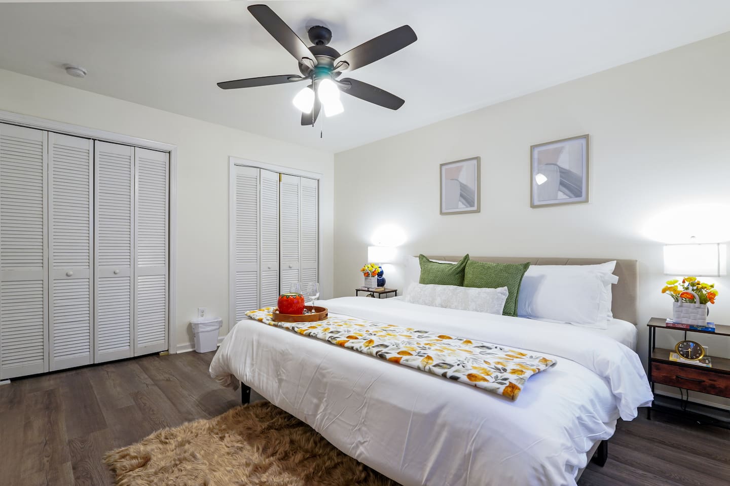 Master bedroom featuring a comfortable king bed and an Amazon Fire-powered Smart TV. The shared bathroom is conveniently right next door. This room includes 2 full-body towels, 2 washcloths, and 2 hand towels for your stay.