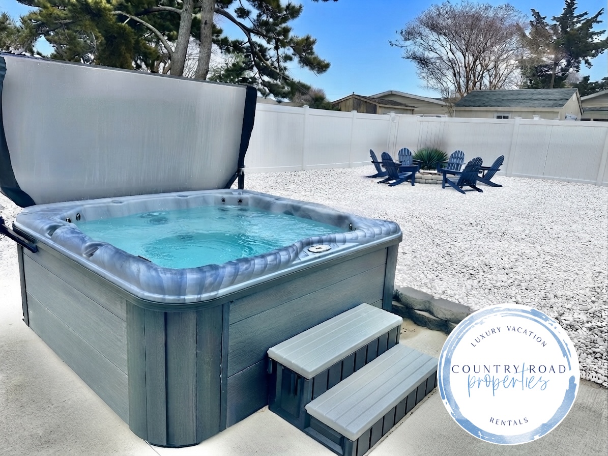 Unwind in our private hot tub, perfectly situated for stargazing. The fenced backyard also features a gravel lounge area with Adirondack chairs—the ultimate spot for evening relaxation and fresh air.