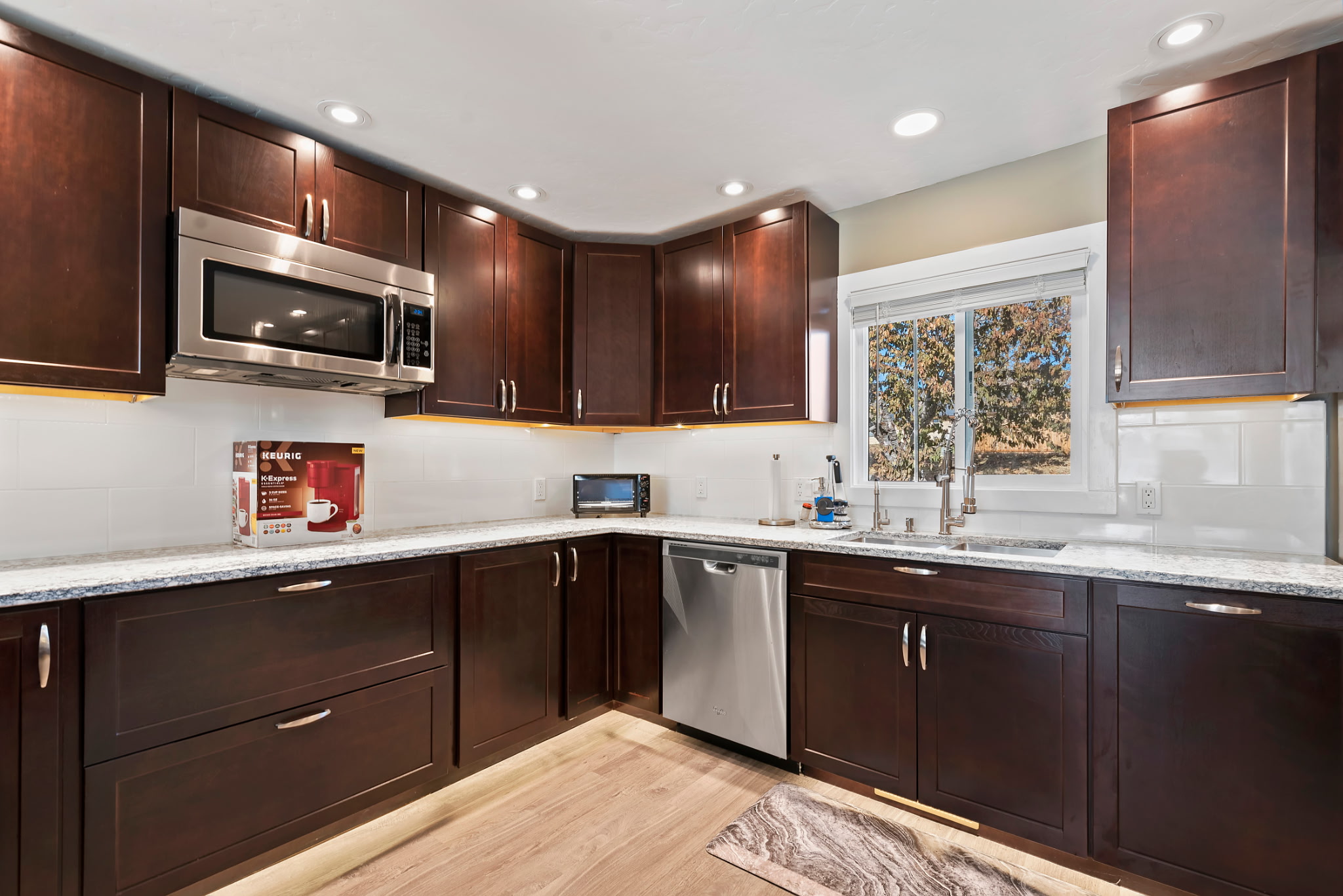 Ample cabinet space available for guest use, with a fully stocked kitchen equipped for preparing home-cooked meals.
