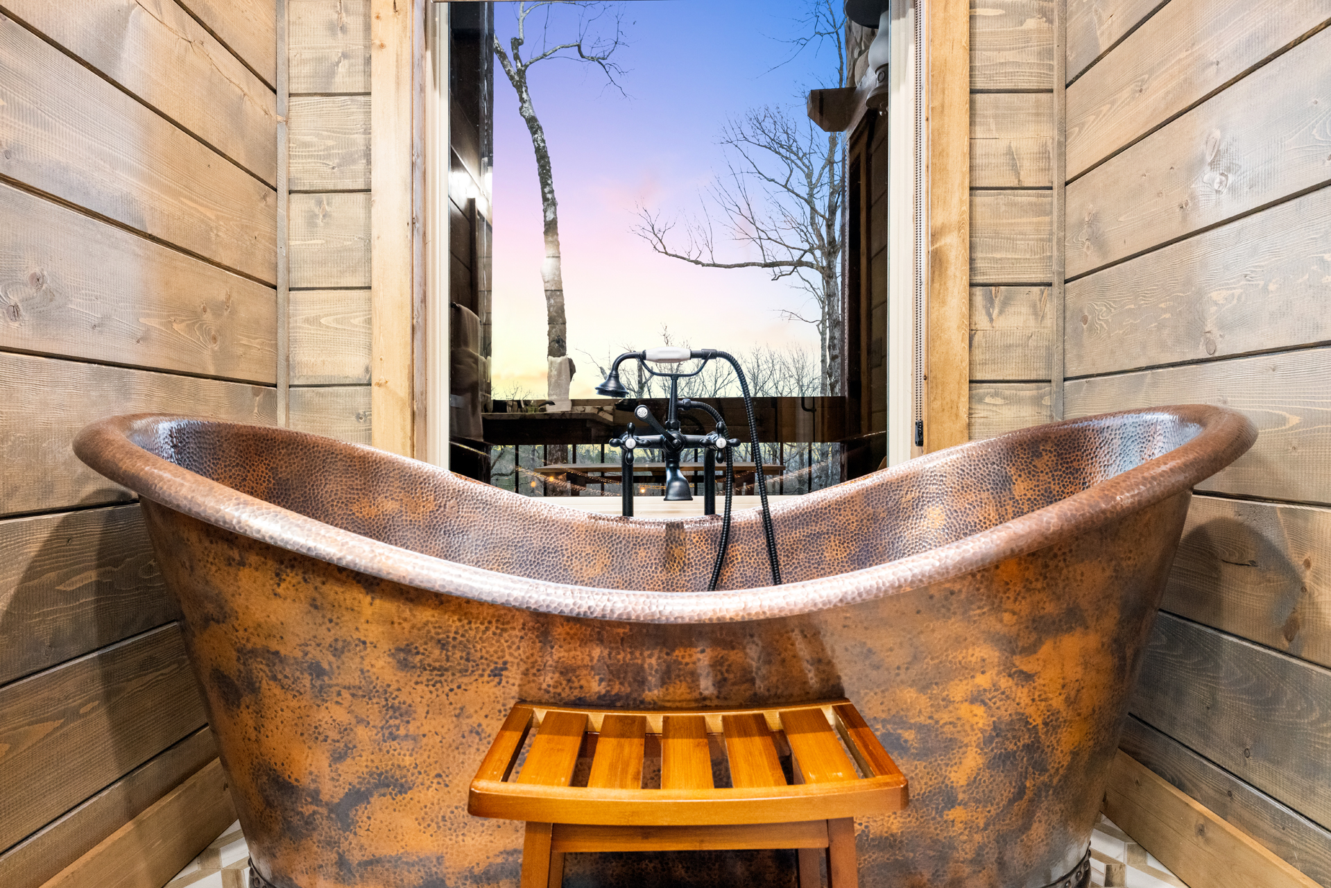 Vintage copper clawfoot tub creating the perfect spa-inspired retreat