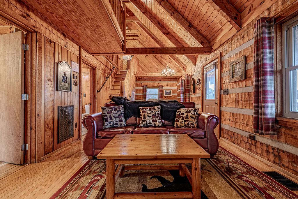 Cozy up on the leather sofa in this welcoming cabin living room
