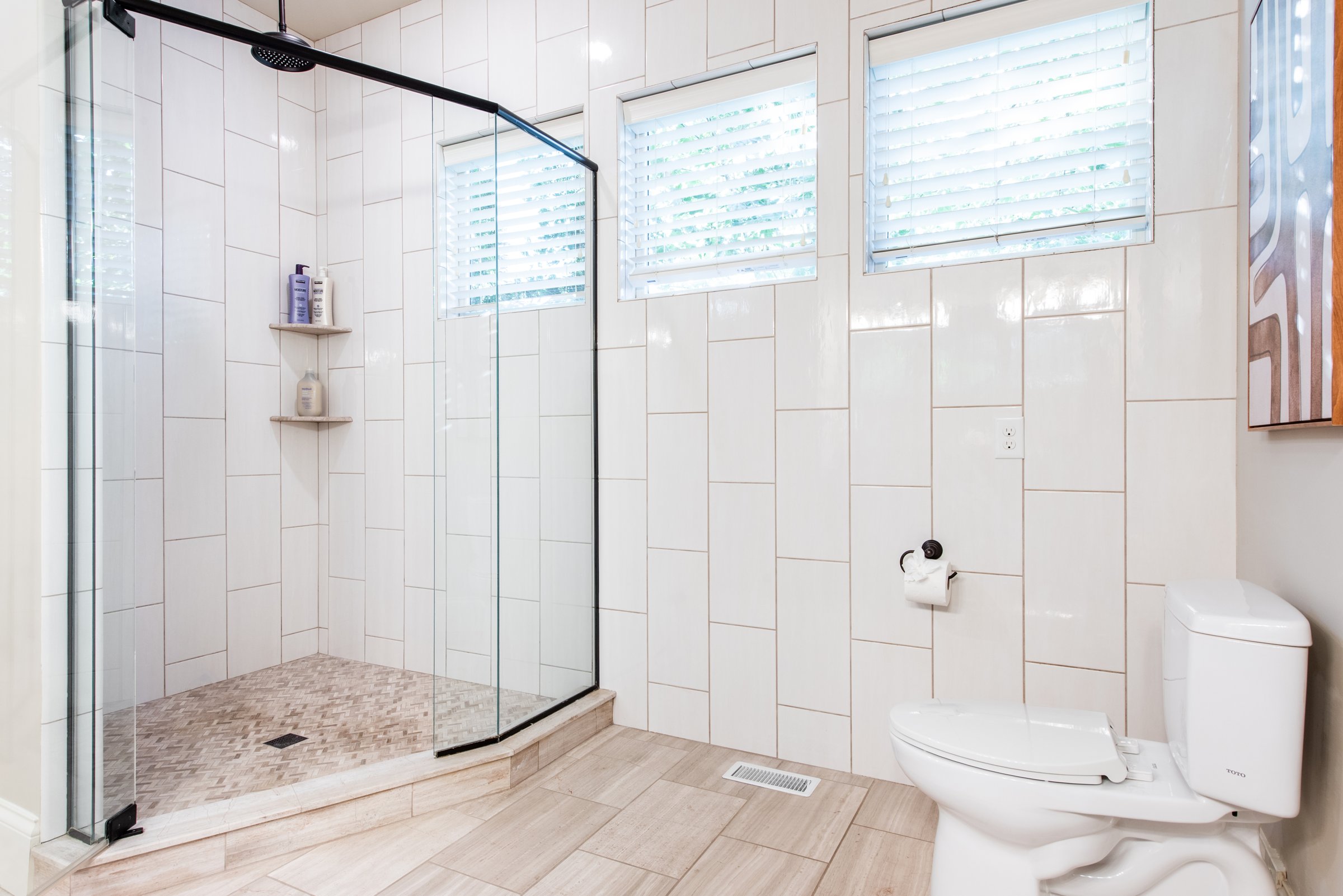 A separate glass shower and water closet for added privacy.