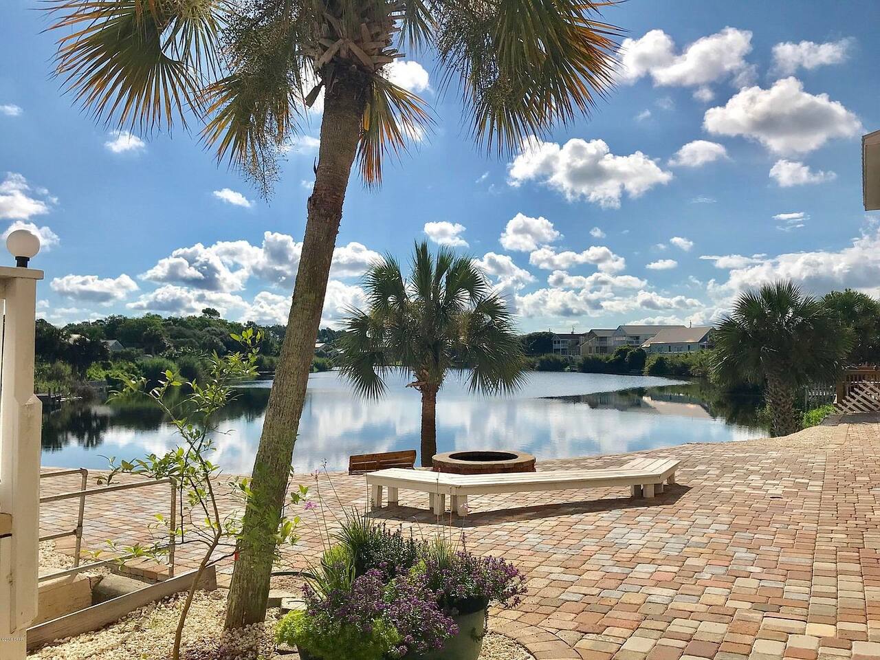 HOA community patio, fire pit and lake.