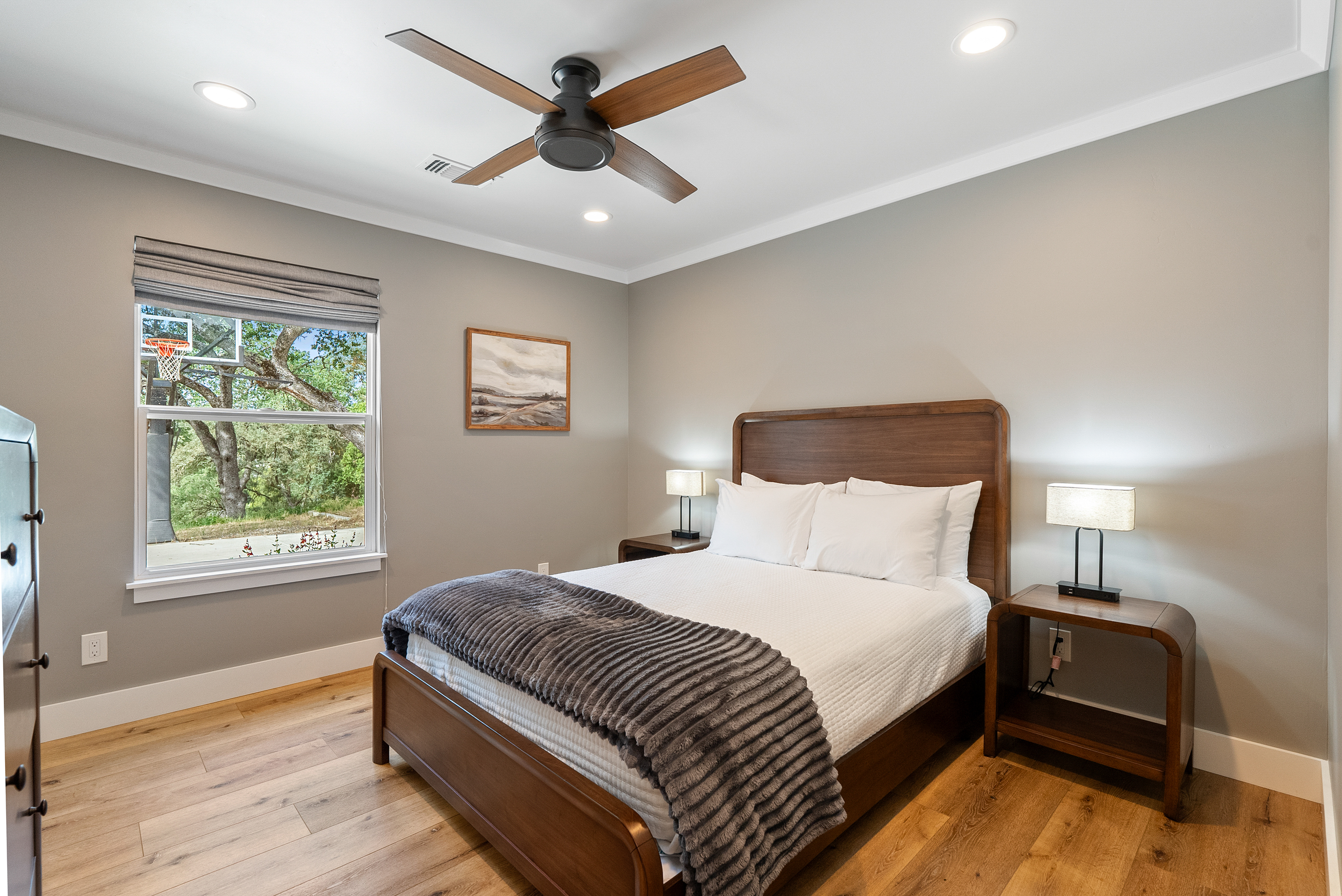 Settled into soft linens and warm wood tones for a deep, restful sleep.