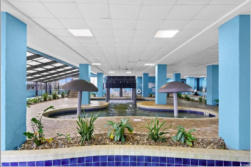 Behold the breathtaking view, where the azure waters of the pool seamlessly blend with the vast expanse of the ocean, creating a true seaside paradise.