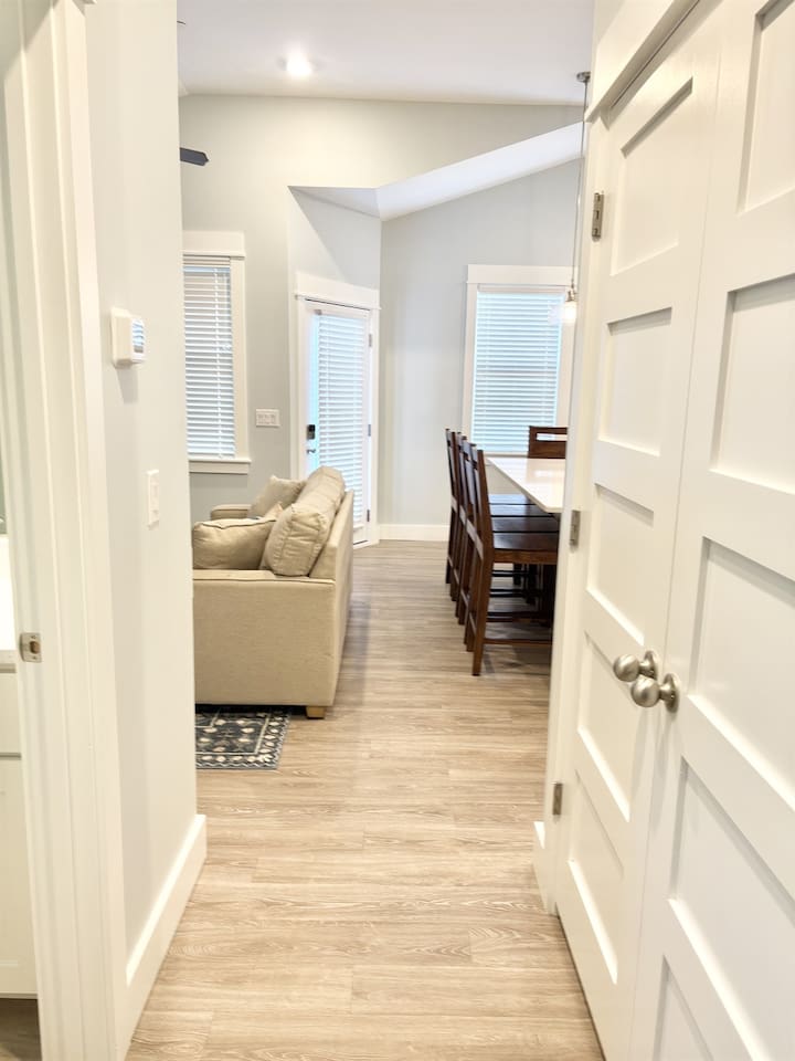 Hallway view connecting living and dining areas