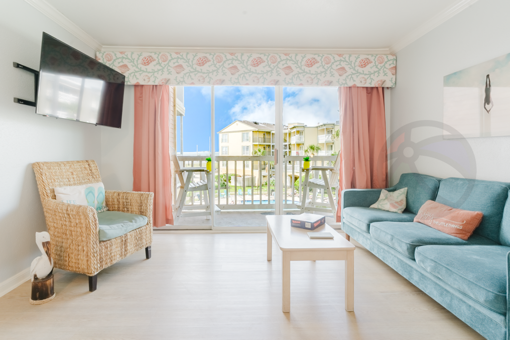 WOW - that view!  And the cozy seating and flat panel television in the living room