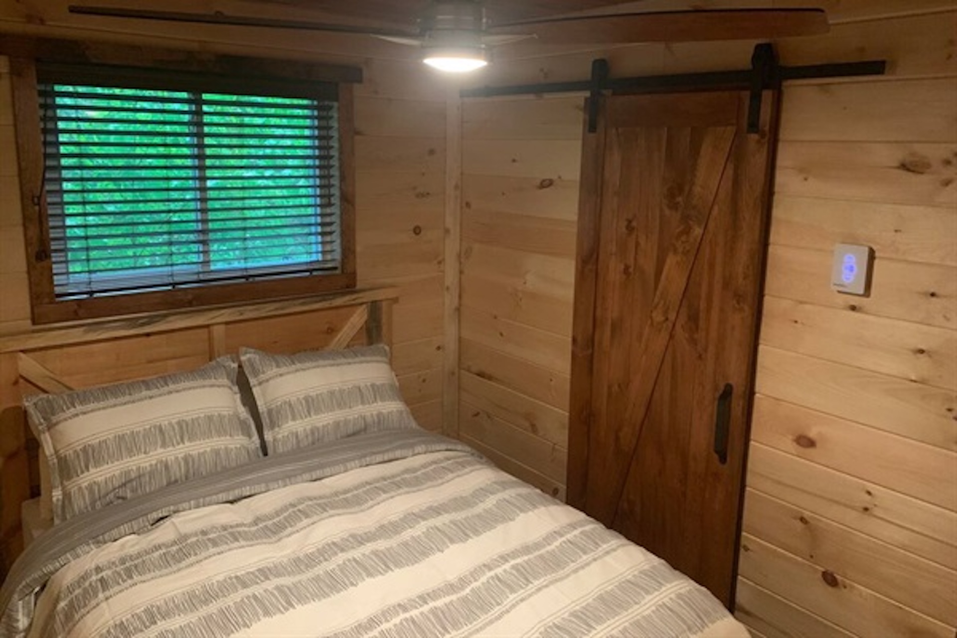 Comfortable bedroom with natural wood finishes
