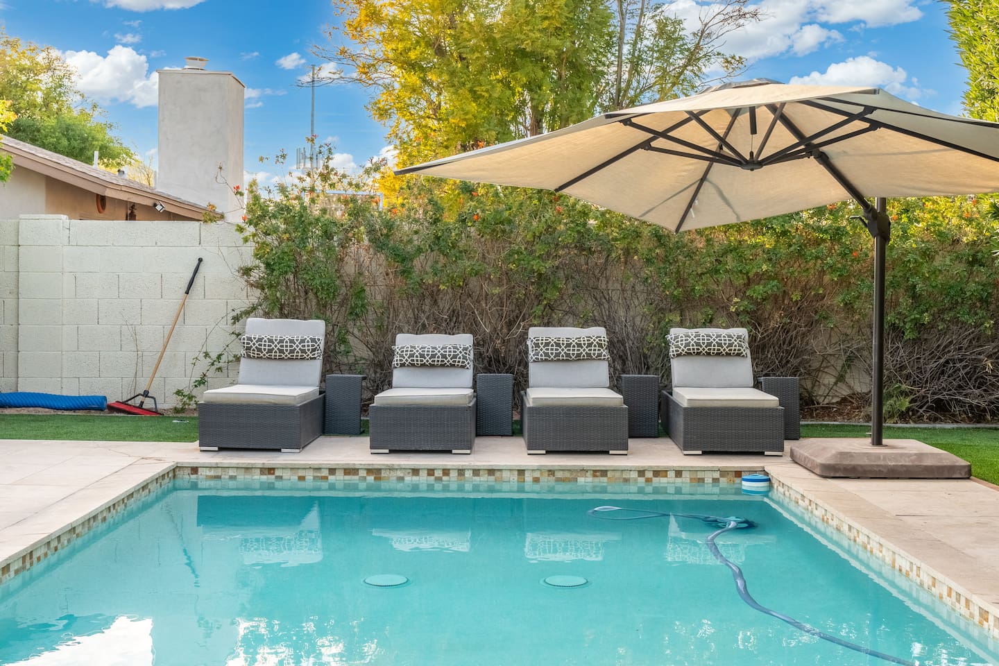A closer look at the plush, stylish loungers and oversized umbrella that make poolside lounging a luxurious daily ritual.