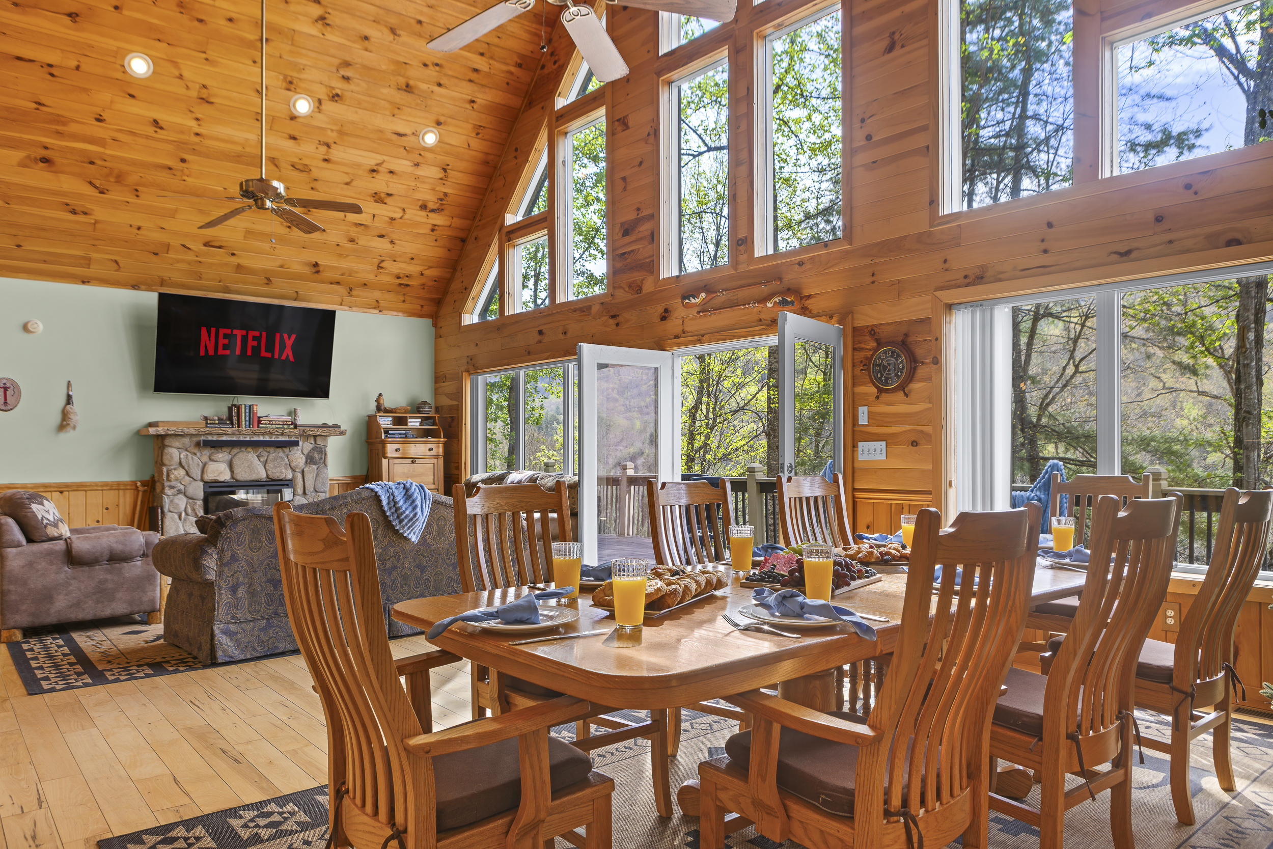 Dining Area and Living Room: Sunlit space with stunning views, perfect for gatherings and movie nights!