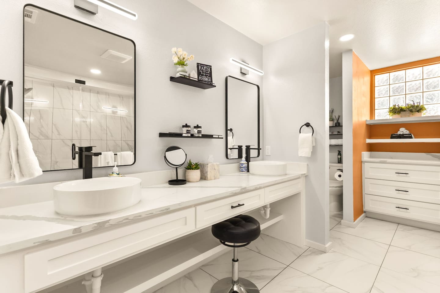 Relax in this brand-new remodeled spa-like bathroom featuring double vanities, soft lighting, quartz counters, and a private walk-in shower area. Bright, serene, and thoughtfully designed so you can unwind and refresh in complete comfort.
