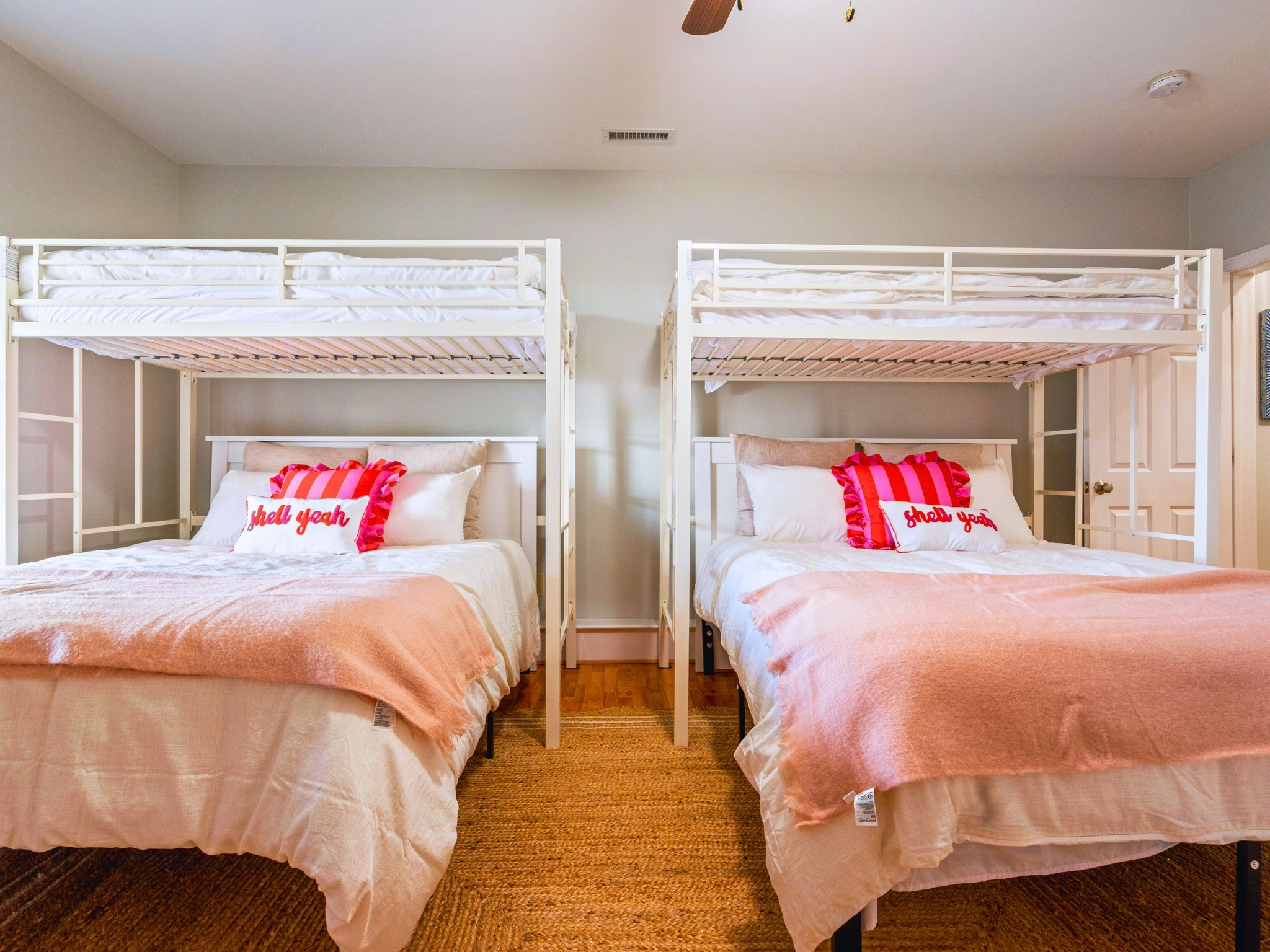 This is the first bedroom down in the basement, featuring two comfy queen beds and two twin beds—plenty of room for everyone!