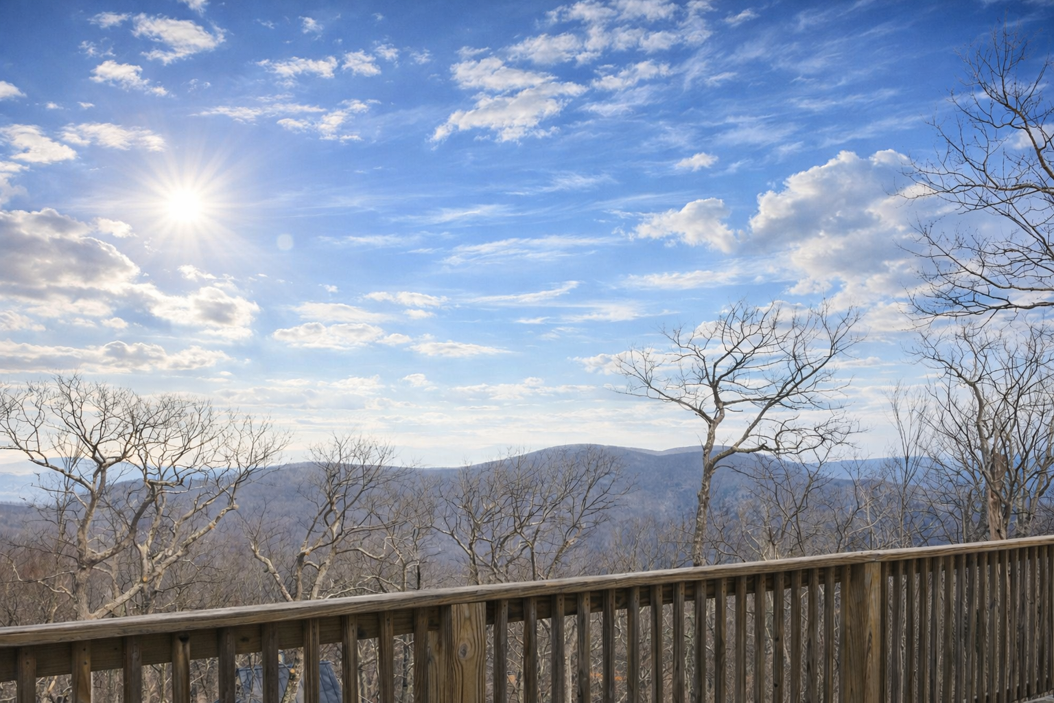 Bare winter trees open up expansive, long-range Blue Ridge vistas—perfect for quiet mornings with coffee or a sunset wind-down on the front deck