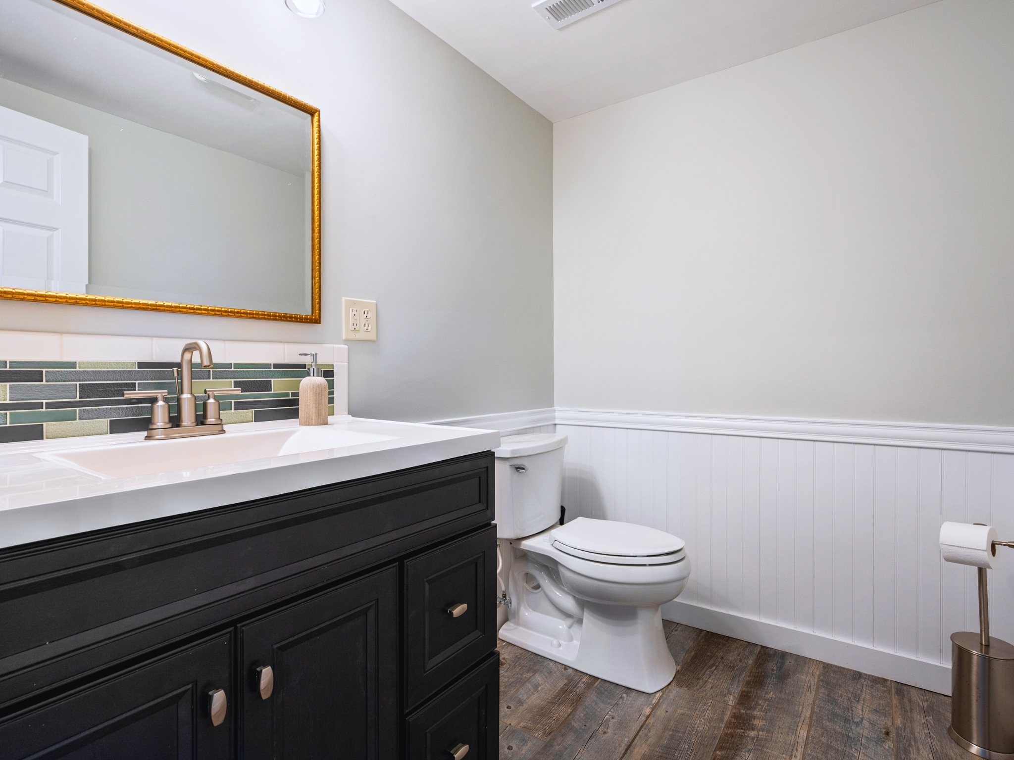 Welcome to our cozy half bath in the basement — a quiet spot to refresh!