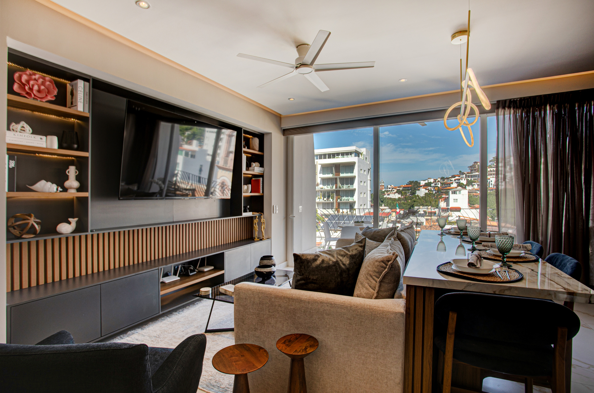 Enjoy a chic, modern living area featuring a comfortable sleeper sofa and stunning mountain views just beyond your door.