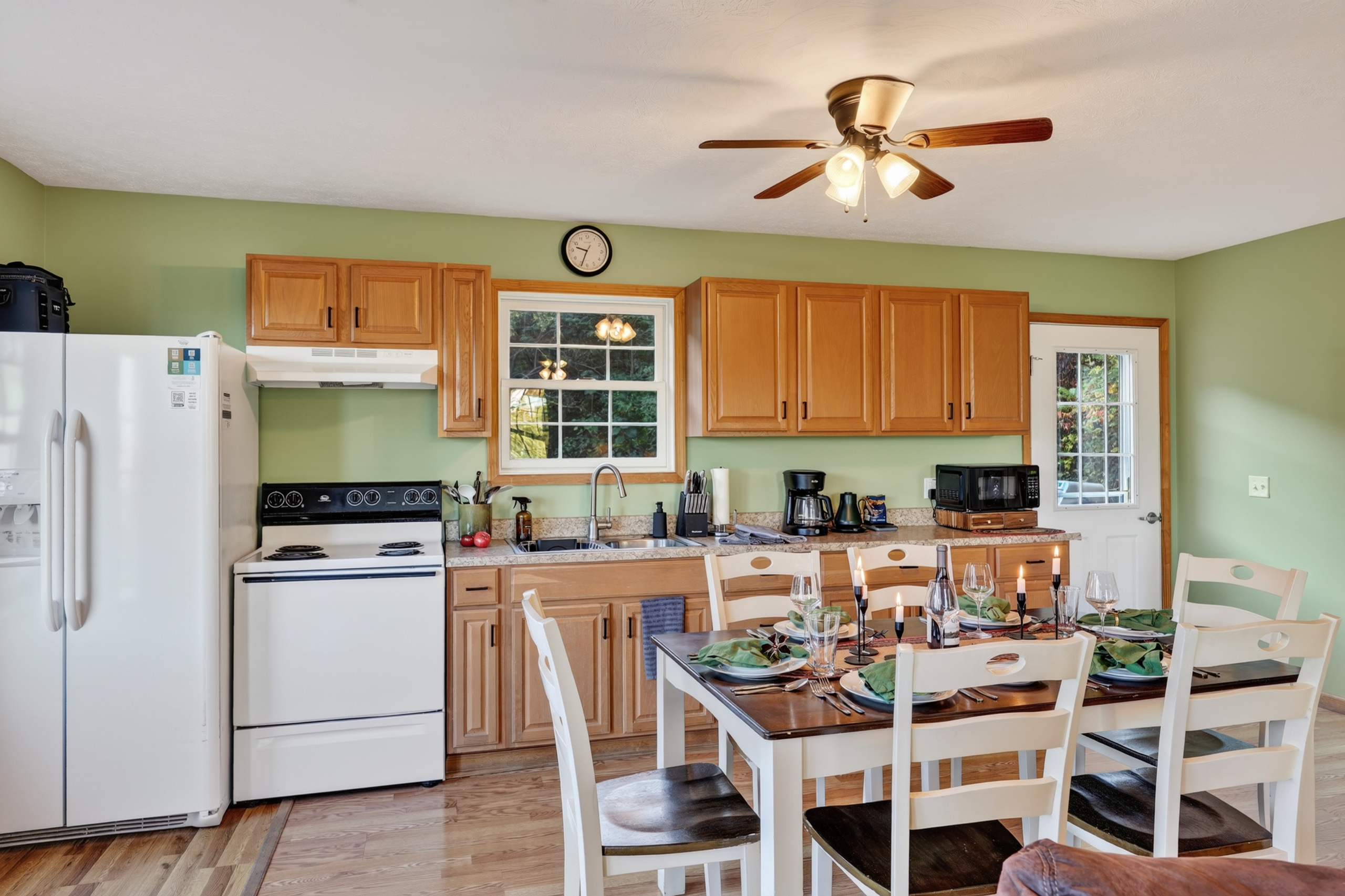 The kitchen is small, but well equipped and shares space with the 6-person dining area, or use the 6-person table out on the deck, or the picnic pavilion.