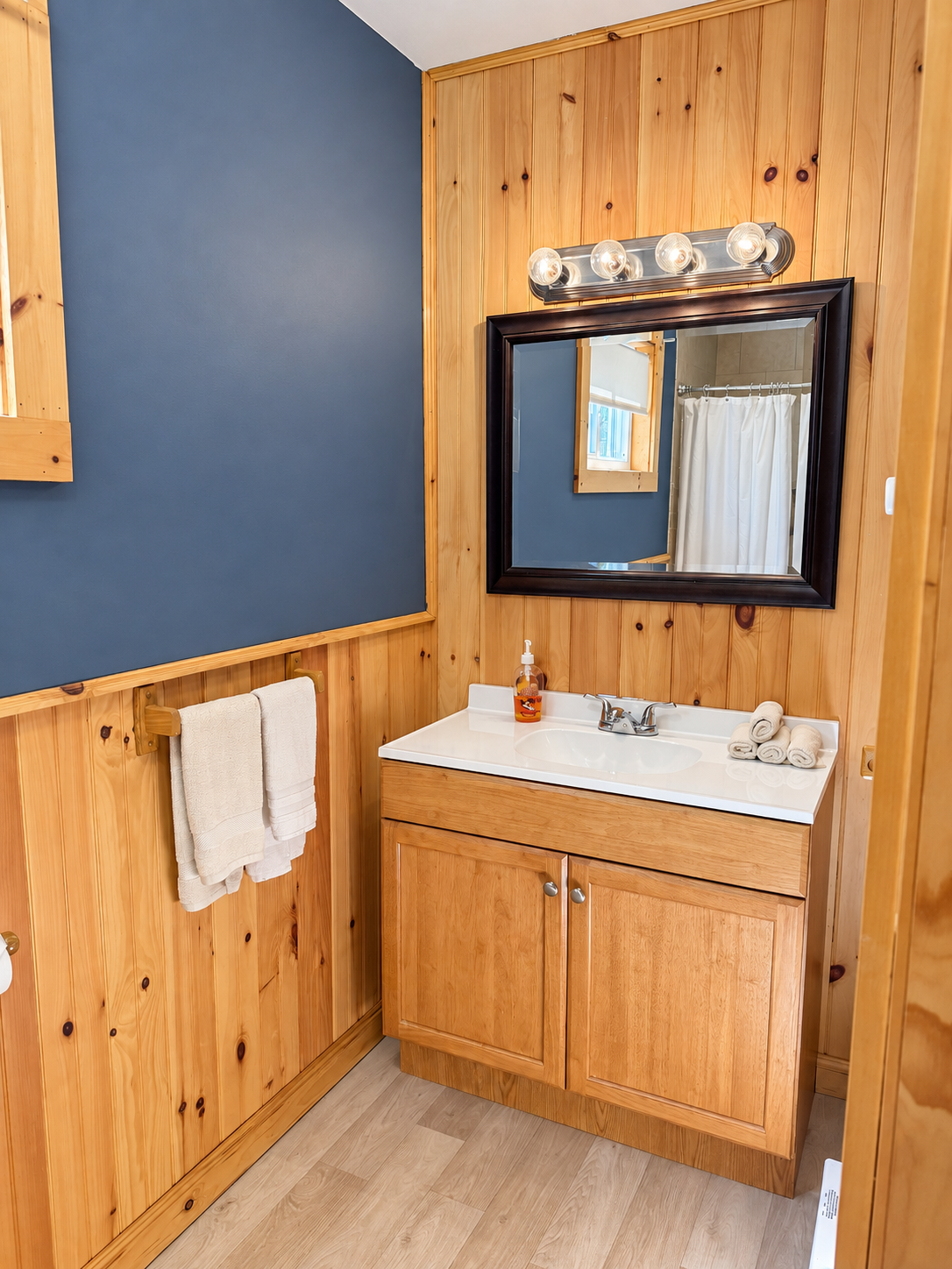 Spacious bathroom with tiled shower