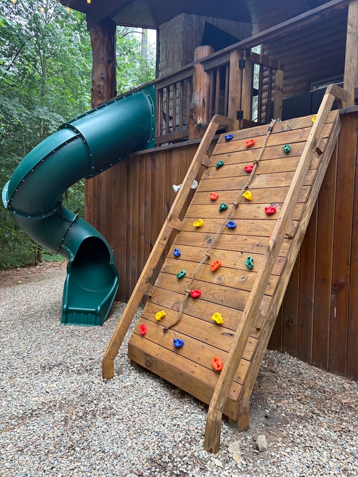 Kids and teens will love hours of adventure on the climbing wall and slide in the backyard.
