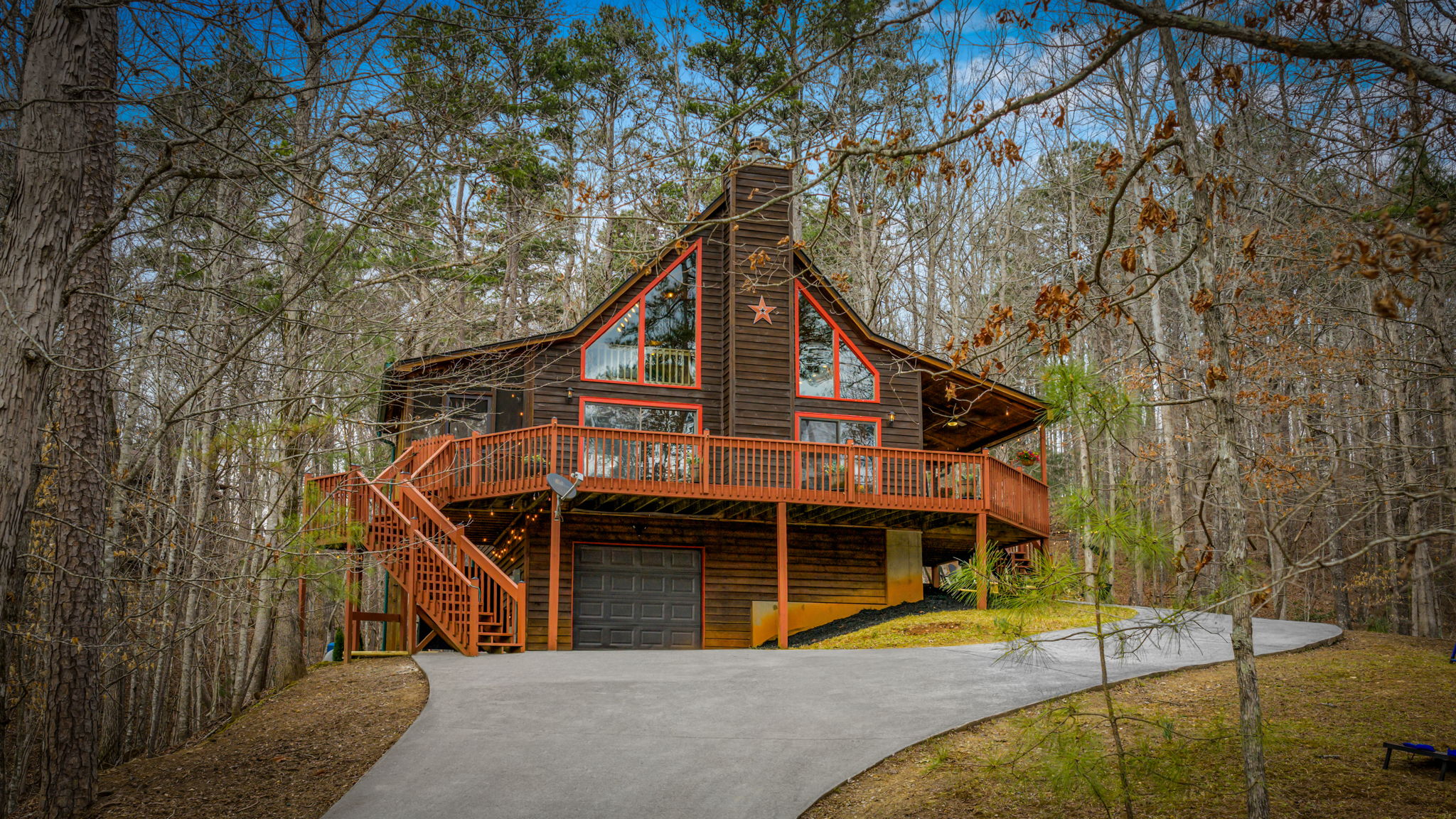 The front exterior of the home showcases a charming design with a well-balanced layout that blends beautifully with its natural surroundings.