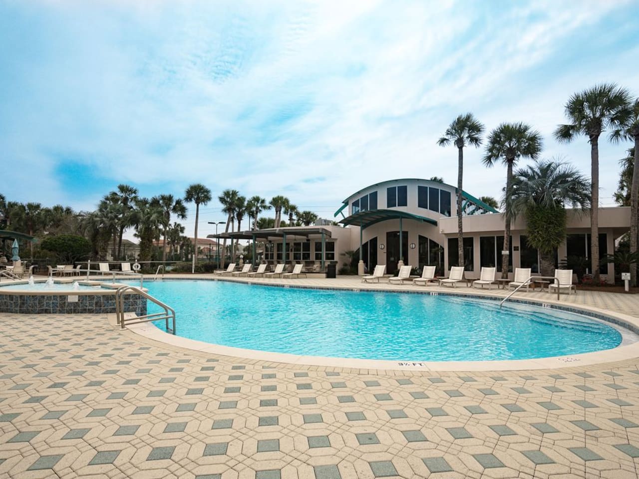 Club House Pool with loungers, tables, and plenty of seating