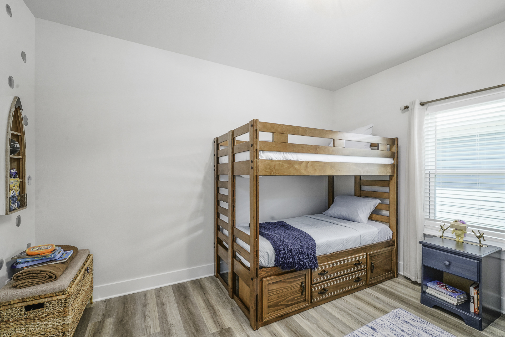 Bedroom 4: Kid-friendly bunk bed space with charming decorative touches throughout.
