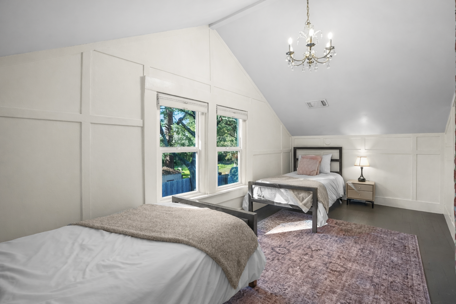This cozy bedroom features two comfortable twin beds, making it a great space for kids, friends, or additional guests. Thoughtfully furnished for a restful night's sleep, it offers a comfortable and inviting place to recharge after a day of exploring Napa