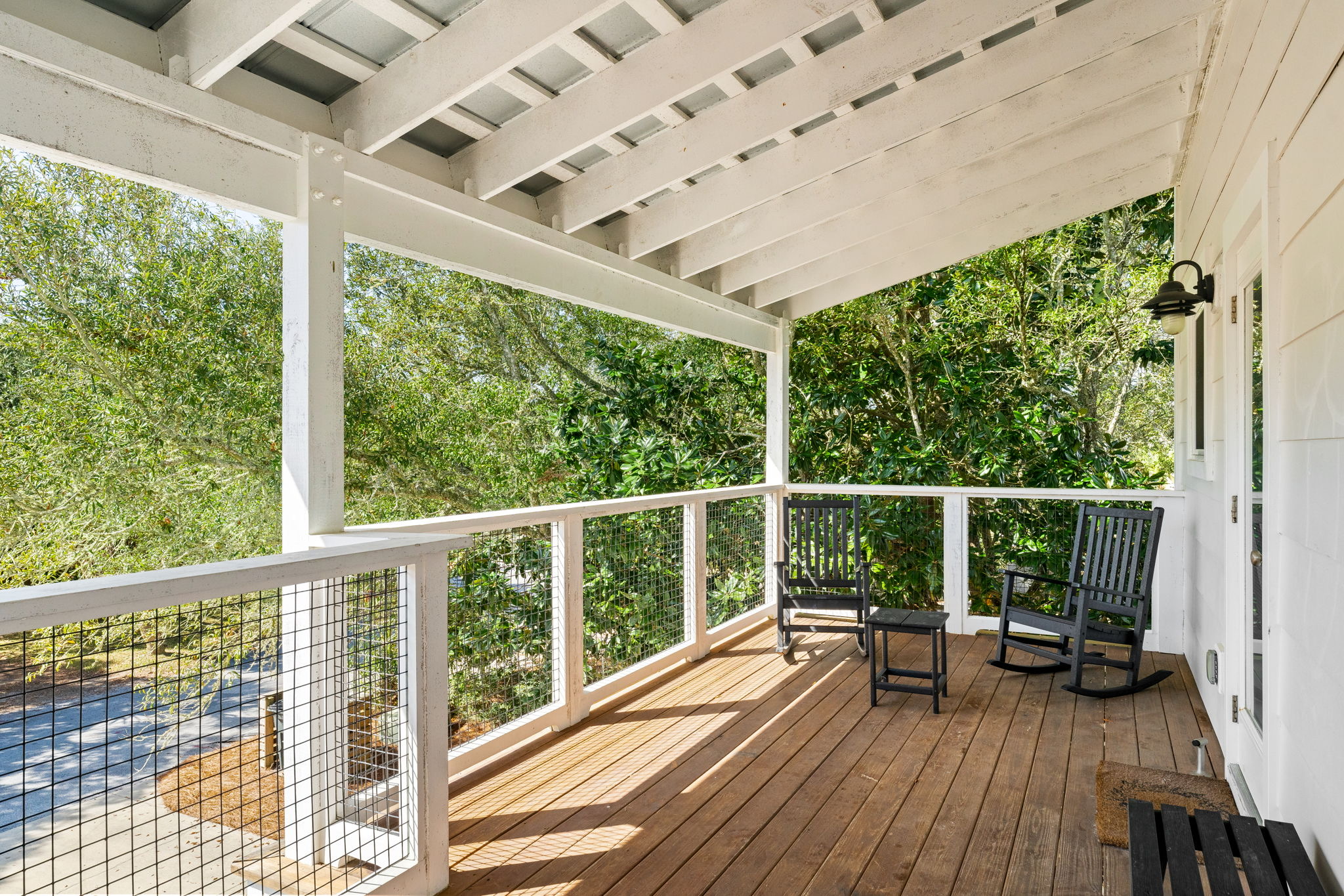 3rd Floor: Shaded front deck—the perfect spot for a morning breeze.