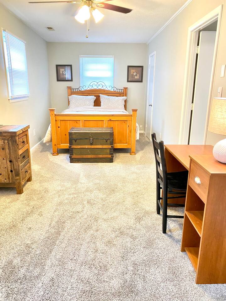 Large, queen bedroom with workdesk, and a half-bath.