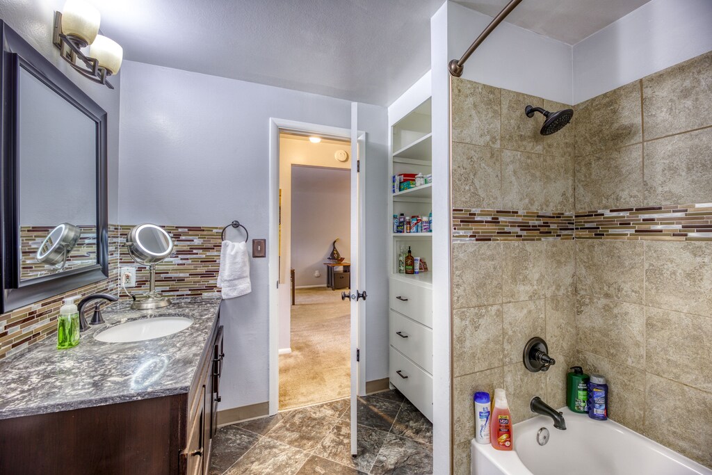 Large, beautiful bathroom with shower and tub.