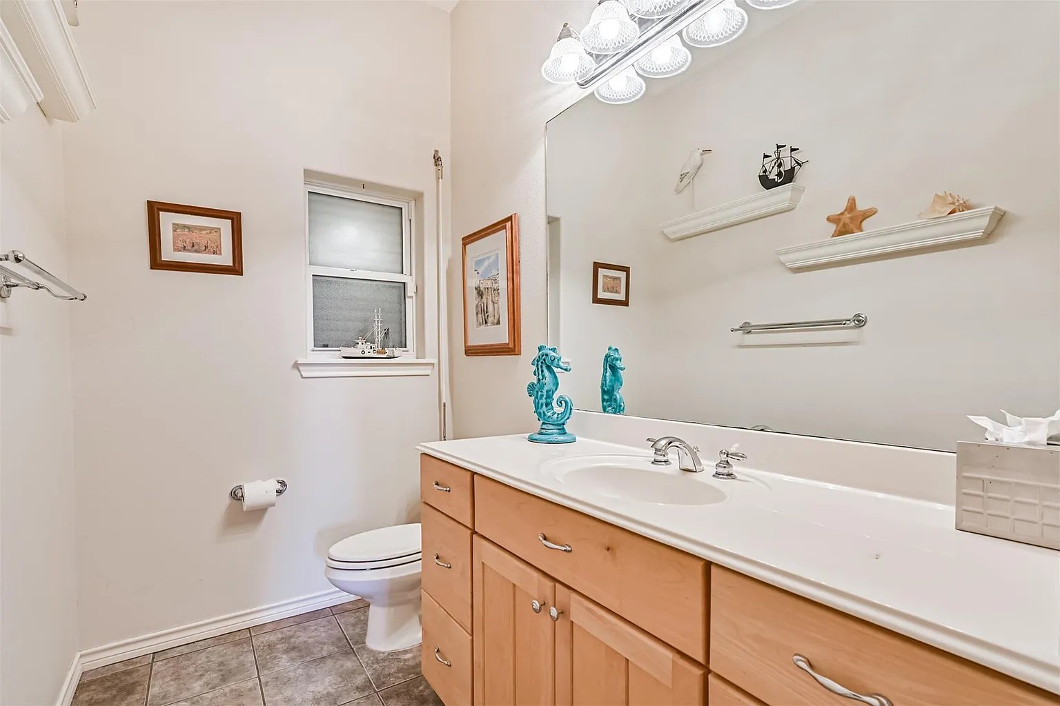 Half bath locate off of the kitchen hallway